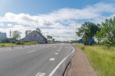 Kalviai, Lithuania - June 20, 2022: Entrance road to Lithuania. Road from Latvia.