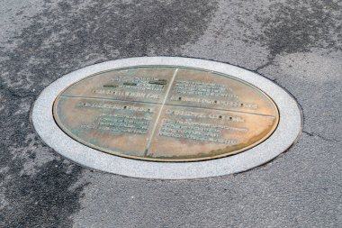 Riga, Latvia - June 20, 2022: Information plaque about Monument of Freedom in Riga.