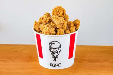 Pruszcz Gdanski, Poland - June 25, 2022: KFC of chicken hot wings. KFC bucket with fried chicken.