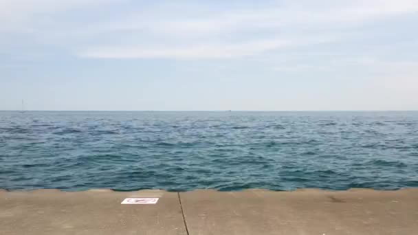 Slow Panning Clip Blue Waters Lake Michigan Corrugated Concrete Shoreline — Stock Video
