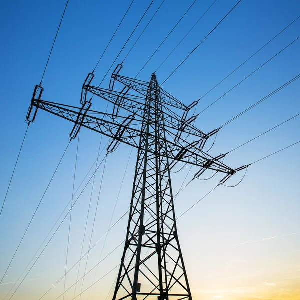 Power pole power line powered electricity electricity electricity costs dusk sunset — Stock Photo, Image