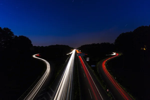 Long time exposure freeway cruising car light trails streaks of light speed highway Aix-la-Chapelle — Stock Photo, Image