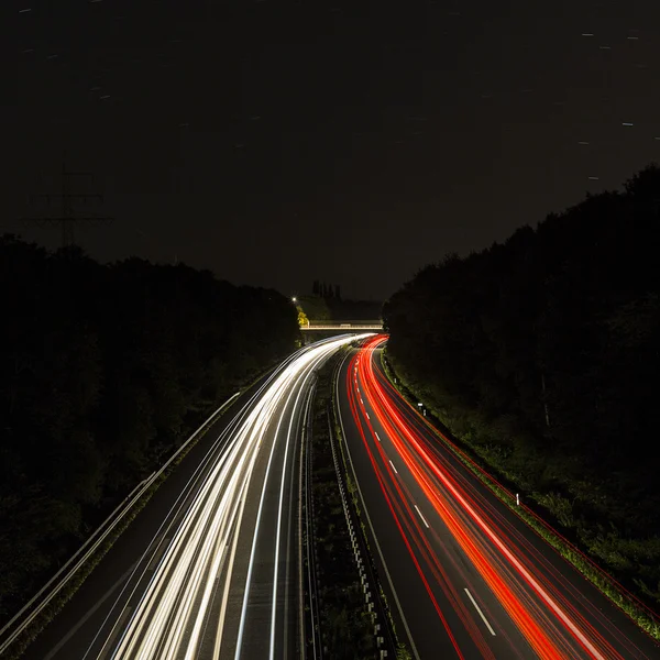 Long time exposure freeway cruising car light trails streaks of light speed highway Aix-la-Chapelle — Stock Photo, Image