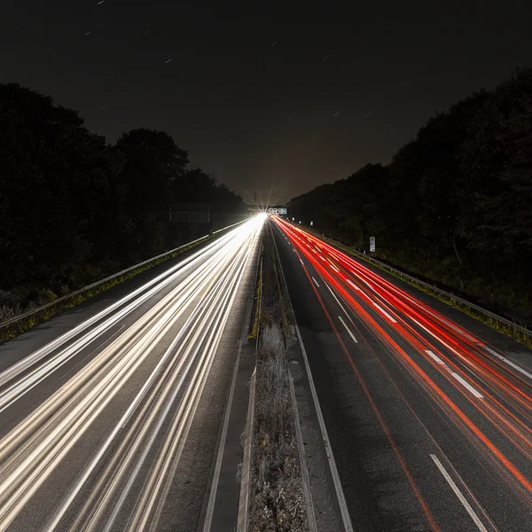 Long time exposure freeway cruising car light trails streaks of light speed highway Aix-la-Chapelle — Stock Photo, Image