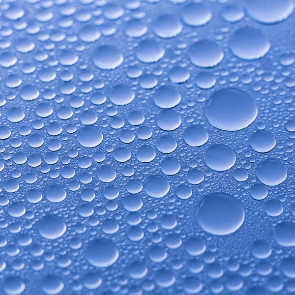 Víz csepp harmat csepp hatása nano hatása lotuseffekt kék impregnálás taszítja eső terelőlap — Stock Fotó