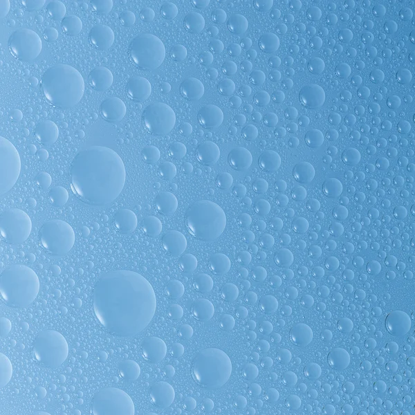 Su damla çiy damla etkisi nano etkisi lotuseffekt mavi emprenye yağmur saptırıcı iter — Stok fotoğraf