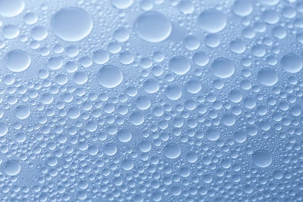 Water drops beading nano effect tau lotuseffekt blue sealer repels rain deflector — Stock Photo, Image