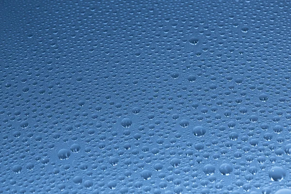 Water drops beading nano effect tau lotuseffekt blue sealer repels rain deflector — Stock Photo, Image