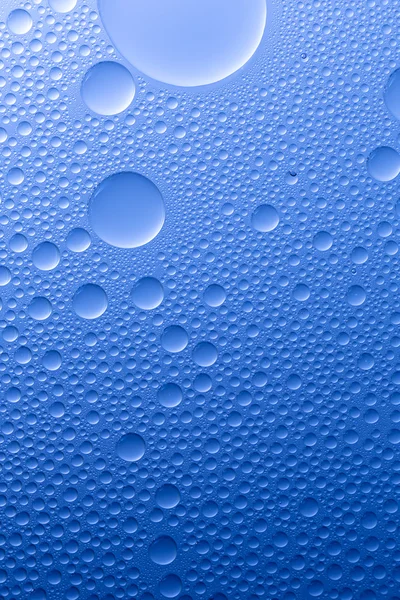 Water drops beading nano effect tau lotuseffekt blue sealer repels rain deflector — Stock Photo, Image