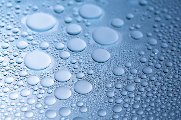 Water drops beading nano effect tau lotuseffekt blue sealer repels rain deflector — Stock Photo, Image