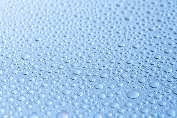 Water drops beading nano effect tau lotuseffekt blue sealer repels rain deflector — Stock Photo, Image