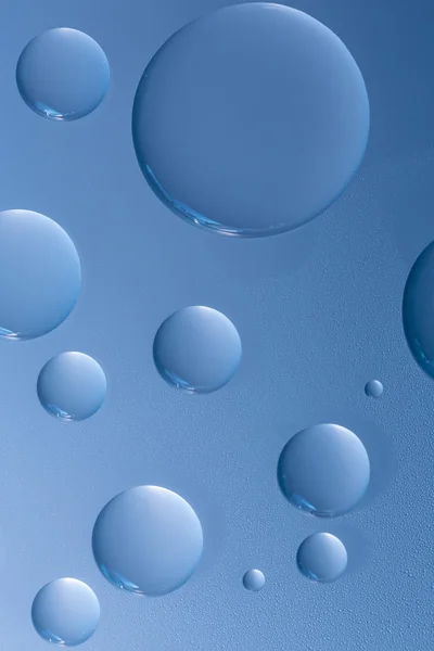 Water drops beading nano effect tau lotuseffekt blue sealer repels rain deflector — Stock Photo, Image