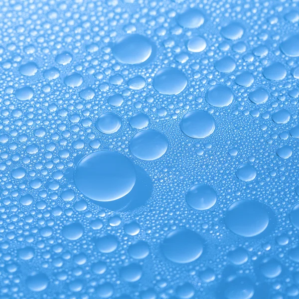 Wassertropfen Taupropfen-Effekt Nano-Effekt Lotuseffekt blaue Imprägnierung weist Regen ab — Stockfoto