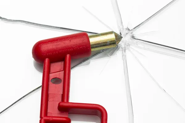 Emergency hammer red rescue disk hammer broken glass splinter danger notfal bus beating thorn window — Stock Photo, Image