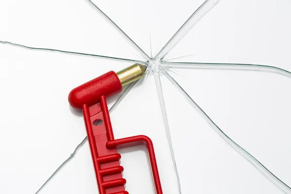 Emergency hammer red rescue disk hammer broken glass splinter danger notfal bus beating thorn window — Stock Photo, Image