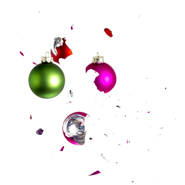 Christmas ball christmas tree ornament decoration impact green red pink explosion shattered — Stock Photo, Image