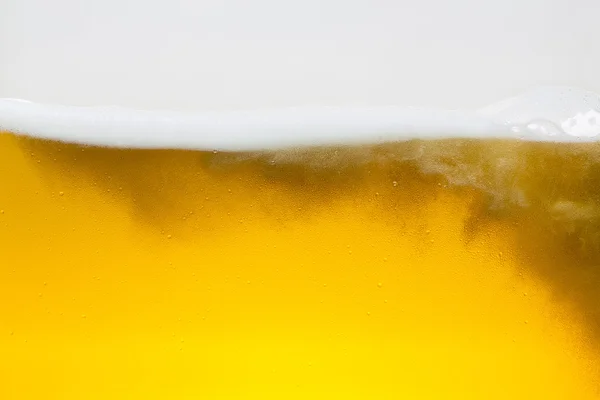 Beer beerfoam beerglass gold foam crown foam wave oktoberfest alcohol brewery restaurant pils — Stock Photo, Image