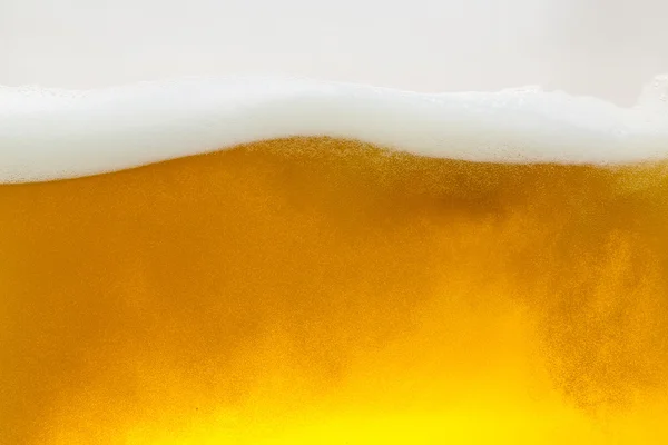 Beer beerfoam beerglass gold foam crown foam wave oktoberfest alcohol brewery restaurant pils — Stock Photo, Image