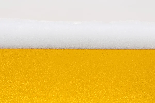 Beer dew drops beer froth glass gold crown foam wave oktoberfest condensing brewery restaurant pils — Stock Photo, Image