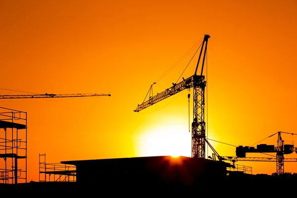 Construction crane silhouette sunset scaffolding architecture eigenheim engineering bausparen — Stock Photo, Image