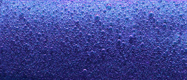 Blauwe abstracte achtergrond met bubbels Stockfoto