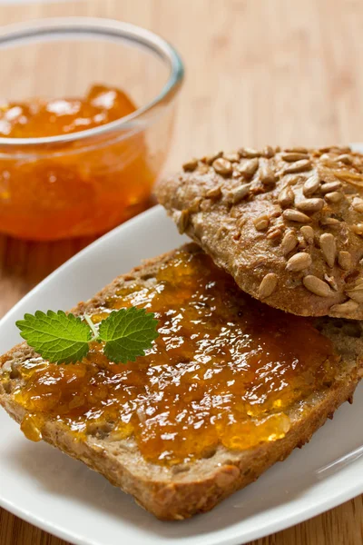 Apricot jam on the bread — Stock Photo, Image