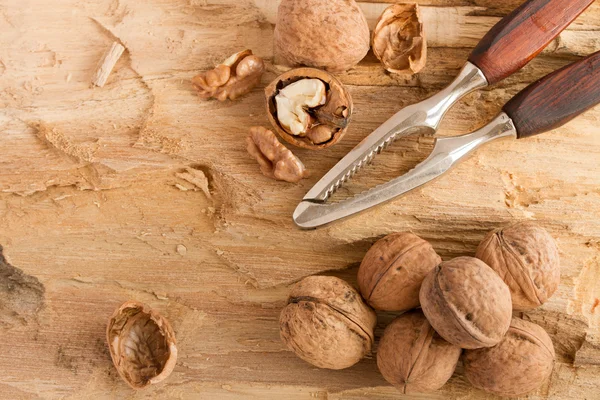 Walnuts with nutcracker — Stock Photo, Image