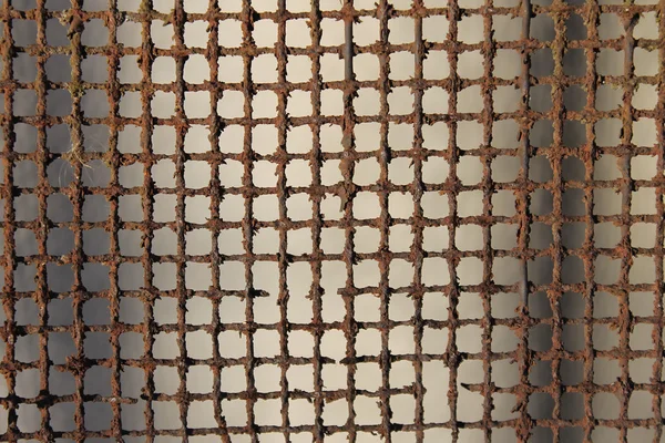Square lattice background rusty metal dark cell — Stock Photo, Image