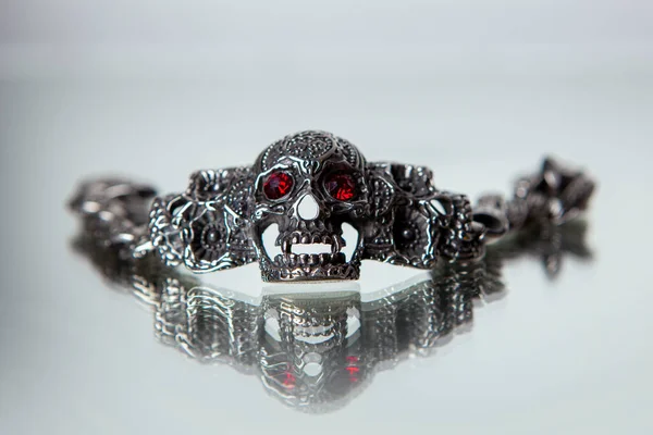 Misterious Steel Bracelet Red Eyed Skull Stock Photo