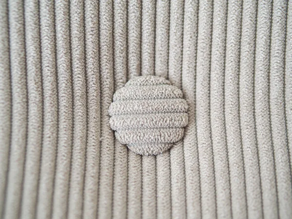 Material de terciopelo beige con líneas verticales y botones redondos —  Fotos de Stock