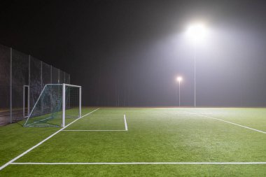 Picture of soccer field in night with spotlight