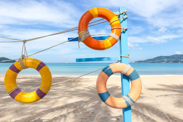 Artificial swim ring rubber on the beach with blue sky in summer at Patong Beach, Phuket Island, Thailand.