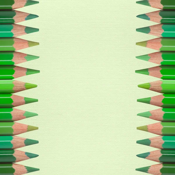 Green pencils on paper texture — Stock Photo, Image