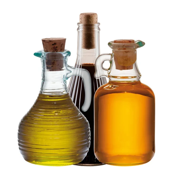 Три бутылки оливки, масла и уксуса — стоковое фото