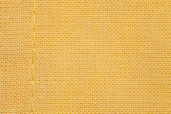 Żółty tkanina tło — Zdjęcie stockowe