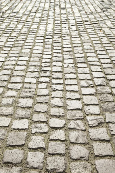 Pavimentazione in ciottoli o pavimentazione in pietra — Foto Stock