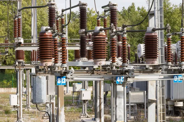 Part of High Voltage Station connectors against sky and woods — Stock Photo, Image