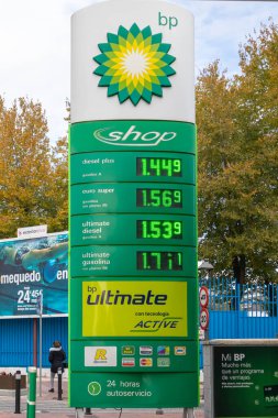 TORREJON DE ARDOZ, MADRID, SPAIN - NOVEMBER 25, 2021: foreground of billboard with gasoline prices at a petrol station of the british oil company bp.bp is one of the biggest companies in the world. 
