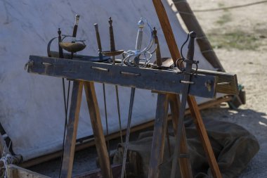 exhibitor with medieval swords from the 16th and 17th century. exhibition of ancient swords