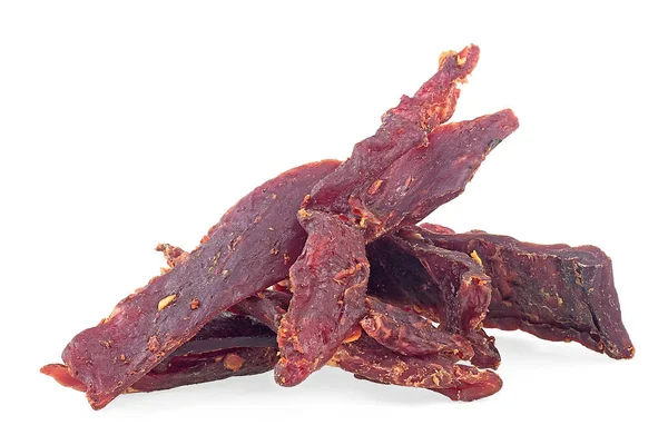 Portion of spiced beef jerky isolated on a white white background. Dried peppered beef jerky.