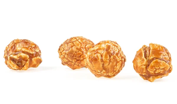 Delicious caramel popcorn isolated on a white background. Creme caramel popcorn.