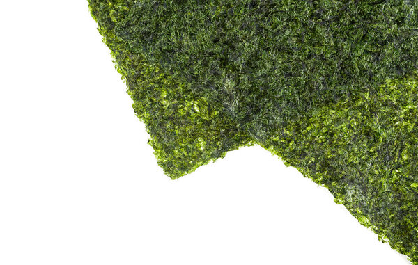 Japanese food - nori leaf. Close-up of nori leaves on a white background, top view. Appetizer made from kelp.