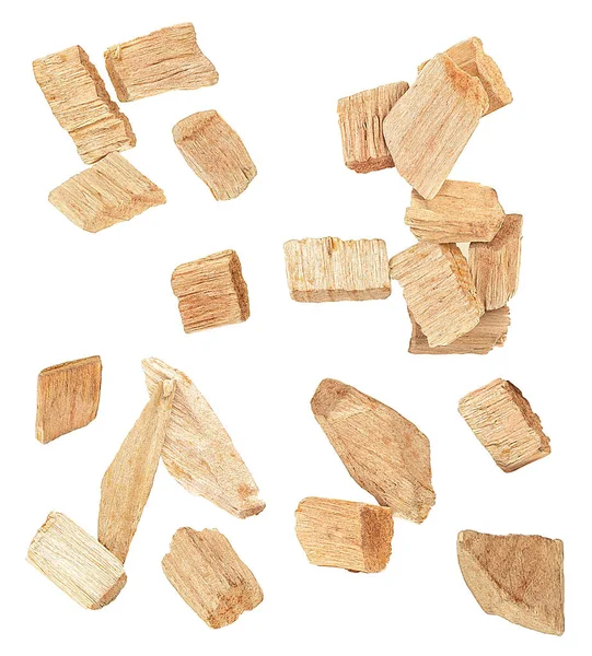 Wood chips isolated on a white background, top view. Set of wood smoking chips.