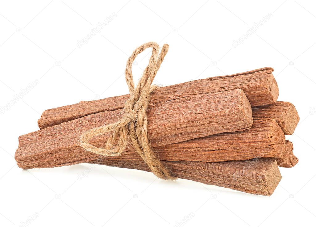 Sandalwood sticks tied with rope isolated on a white background