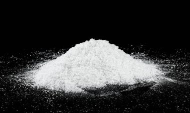 Pile of white snow on a black background. Snow crystals. Snowdrifts.