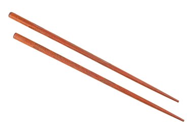 Wooden chopsticks isolated on a white background. Brown color.