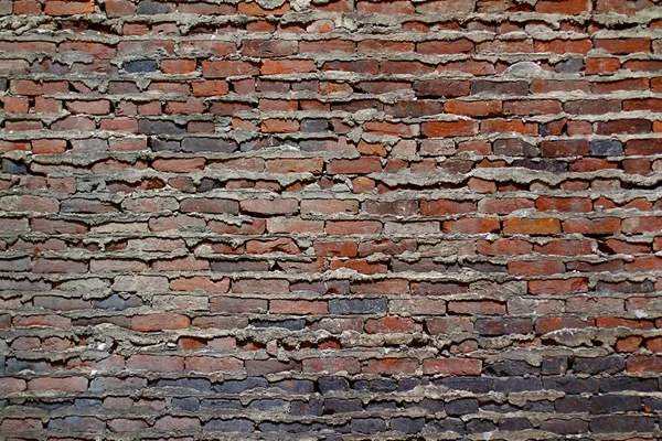 Achtergrond muur textuur van een oude sectie gevel — Stockfoto