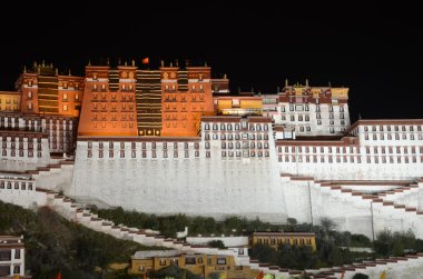 Tibet, the Potala Palace in Lhasa, the residence of Dalai Lamas at night clipart