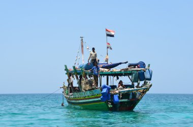 Ship under Yemeni flag in the Arabian sea clipart