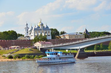 Novgorod, Russia, July, 06, 2014. Russian scene: Pleasure boat passes by the walls of the Novgorod Kremlin